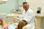 Coral Springs dentist Dr. Diego Azar explaining dental implants to patient at Smile Design Dental of Coral Springs